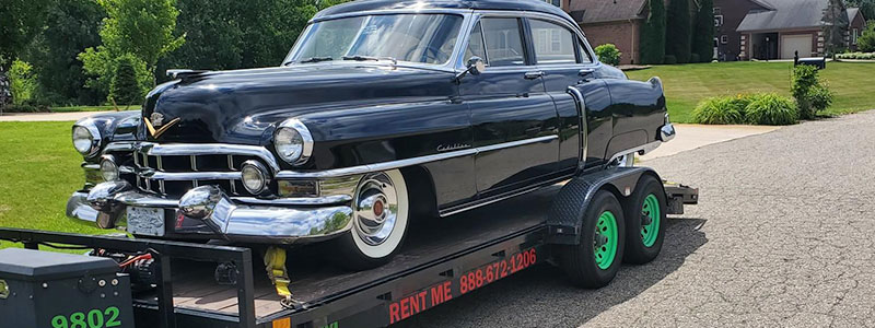 Car Trailer Rental in Howell MI with Collectible Car On Top