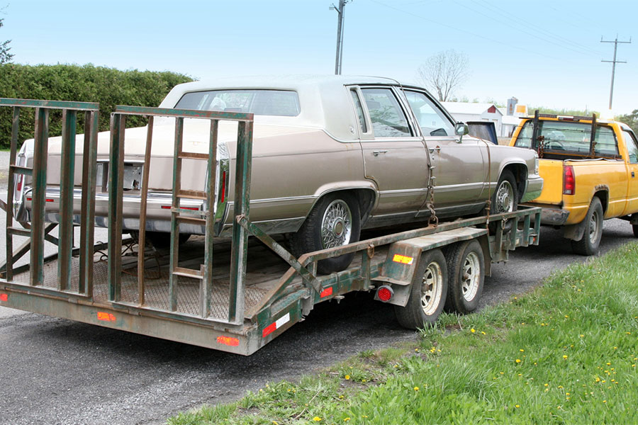 Car on Trailer with Truck